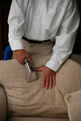 Furniture being steam cleaned